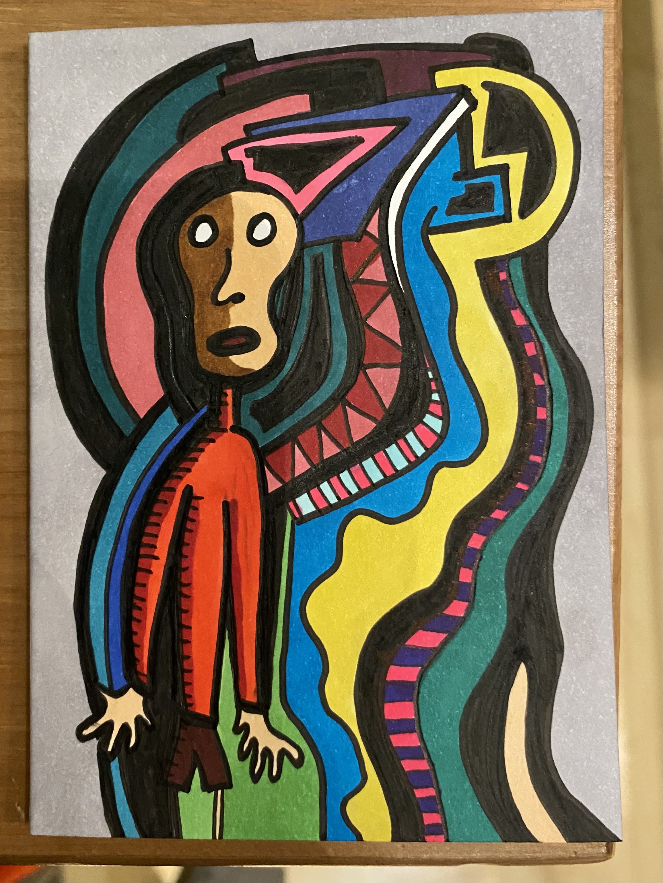 A rather abstract drawing in ink and colored in marker of a man in a red shirt and dark red shorts with colorful shapes all around. His visage is colored half in a darker shade and half in a lighter one, giving the impression of a theatrical mask.
