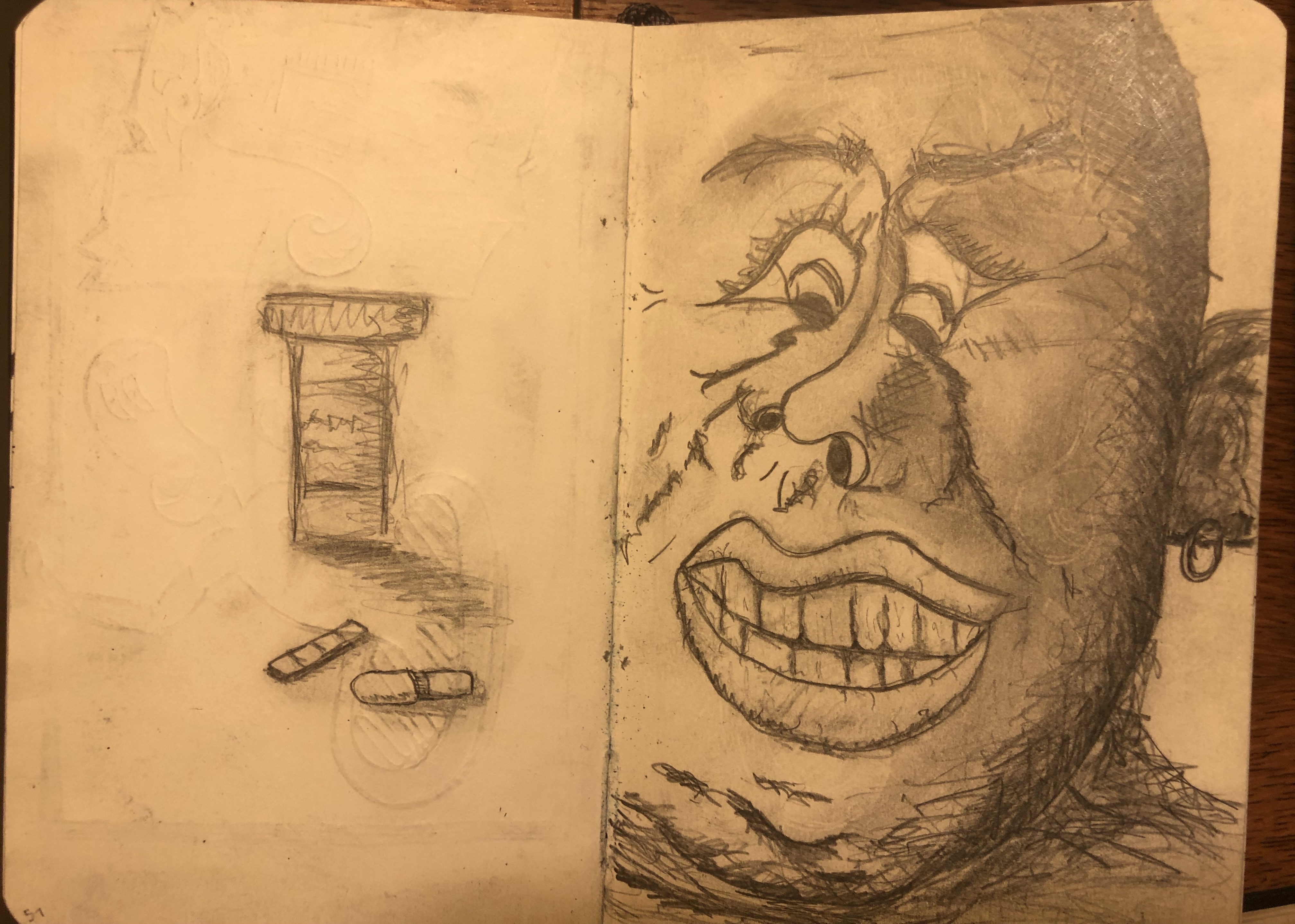 Pencil illustrations on two opposing pages of a sketchbook. On the left is a prescription bottle with two pills lying next to it. On the other page is a character with a distorted face, gazing lustfully at the pills.